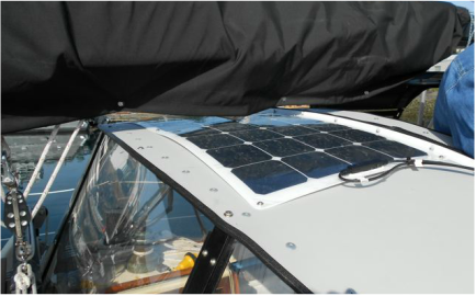 110 Watt Semi-flexible Marine Solar Panel Attached to a Hard Top Dodger Using 3M VHB Tape and Fasteners on a Sailboat