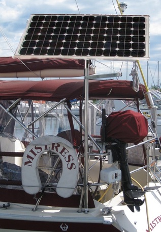 130 watt rigid marine solar panel mounted to top of pole on sailboat 38 foot  Ericson