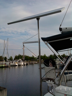 hunter sailboat with rigid marine solar panel mounted with top of pole system