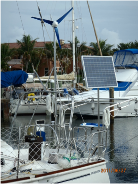 CMP 90 watt solar panel mounted top of pole and wind generator mounted top of pole on a sailboat