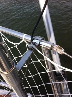 custom upper mounting hardware for sailboat solar panel pole on sailboat stern rails