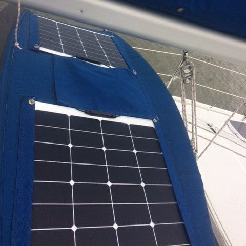 2 flexible marine solar panels mounted on a sailboat dodger