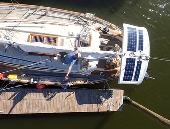 Four Flexible Solar Panels Managed by Two Controllers on sailboat, aerial view of boat