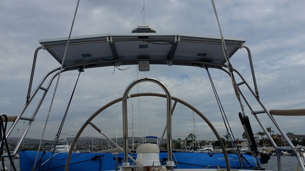 Three 120 watt rigid marine solar panels with SunPower cells on boat