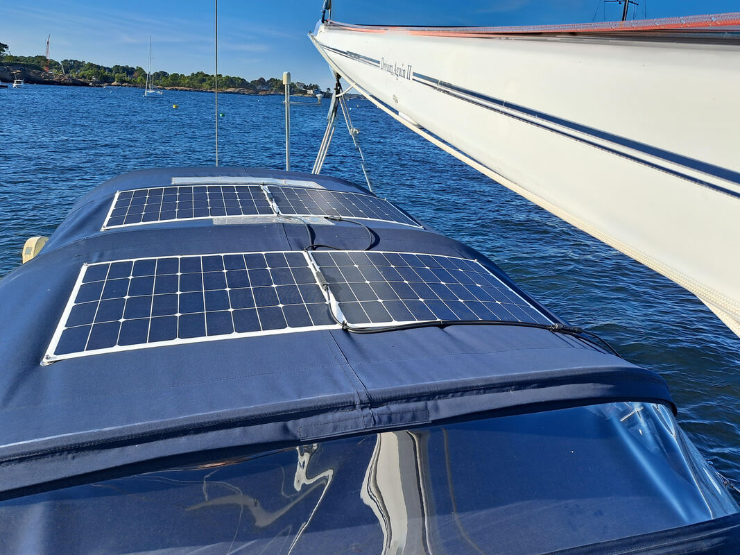 Flexible marine solar panel on sailboat bimini