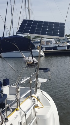 120 watt rigid marine solar panel mounted top of pole on catalina 31 sailboat