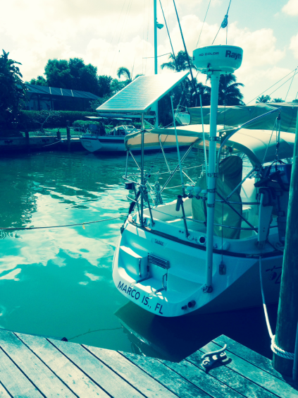 140 watt rigid marine solar panel mounted top of pole on sailboat stern