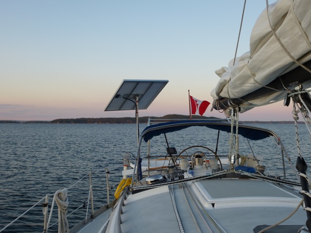 CMP 140 Watt Pole Mounted Rigid Marine Solar Panel on a Freedom 32 sailboat using adjustable top of pole solar panel mounting system