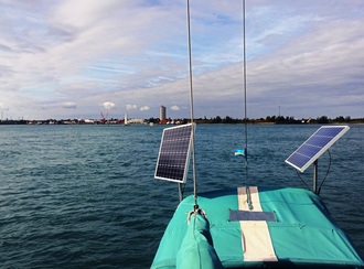 2 100 watt polycrystalline marine solar panels mounted on poles on sailboat