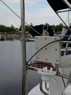 pole brackets holding up top of pole solar panel mounting system on sailboat