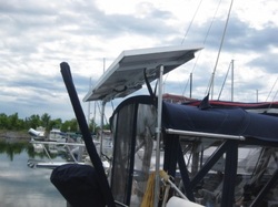 two rigid marine solar panels mounted on frame on boat