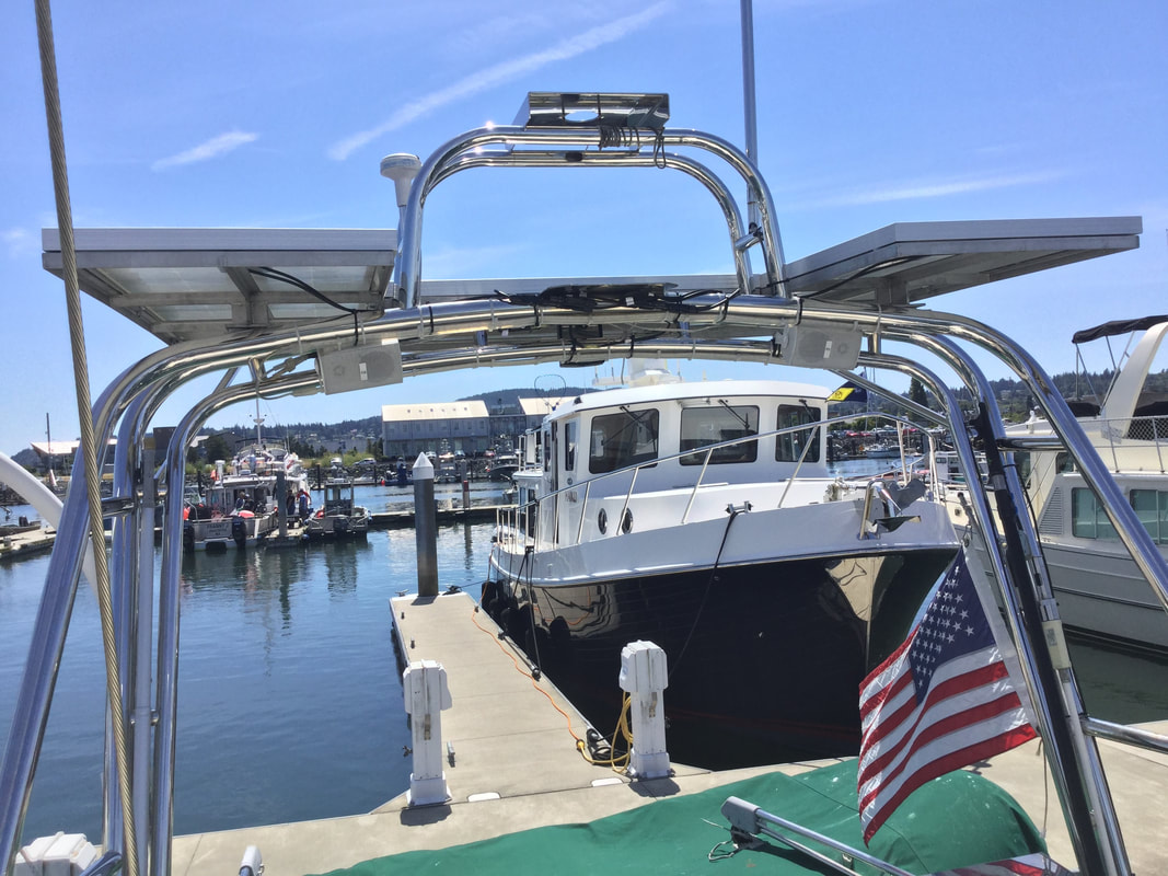 Rigid marine solar panels mounted on boat roof