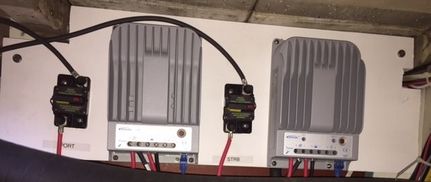 Two 30 amp EP Tracer BN MPPT Controllers. Two 160 Watt Panels on Each Mounted in boat