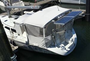 Rigid marine solar panels mounted on sailboat stern