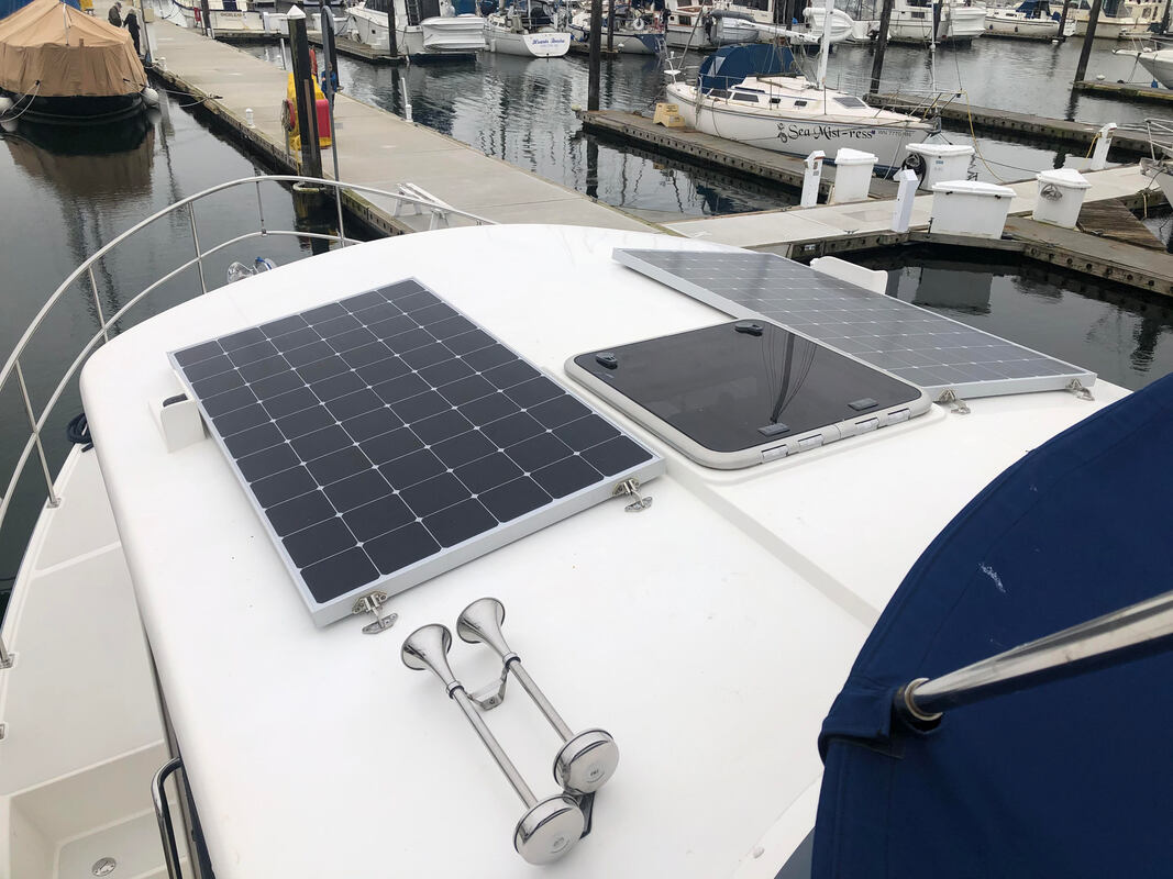 Rigid marine solar panel on boat