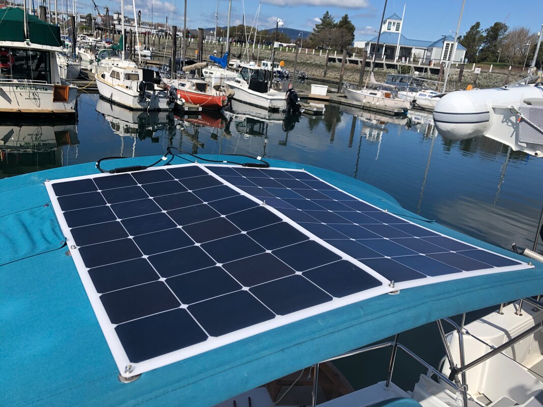 2 flexible marine solar panels mounted on dodged canvas on boat