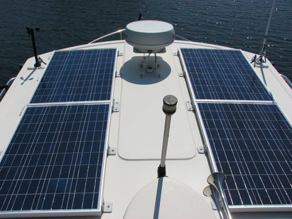 Four 100 Watt rigid marine Solar Panels on a Nordic Tugboat 32 